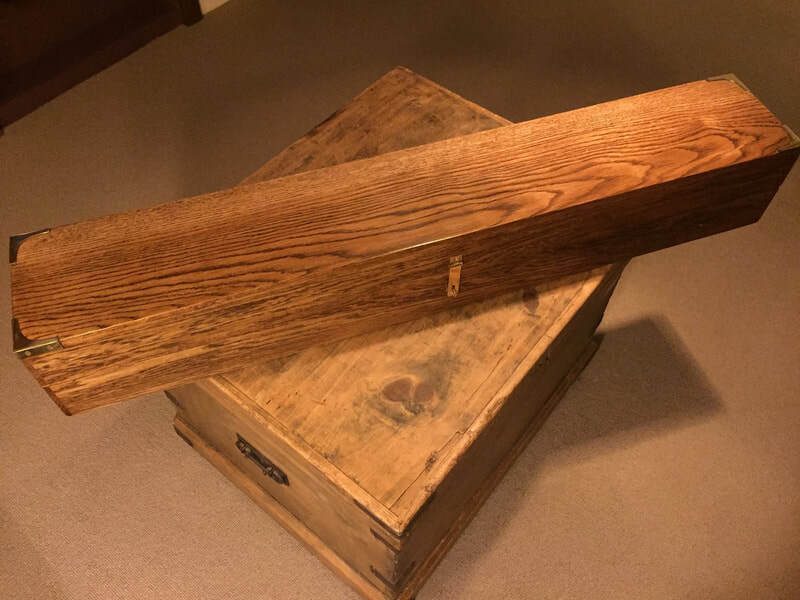 Cavalry sabre presentation box for a revered programmer.