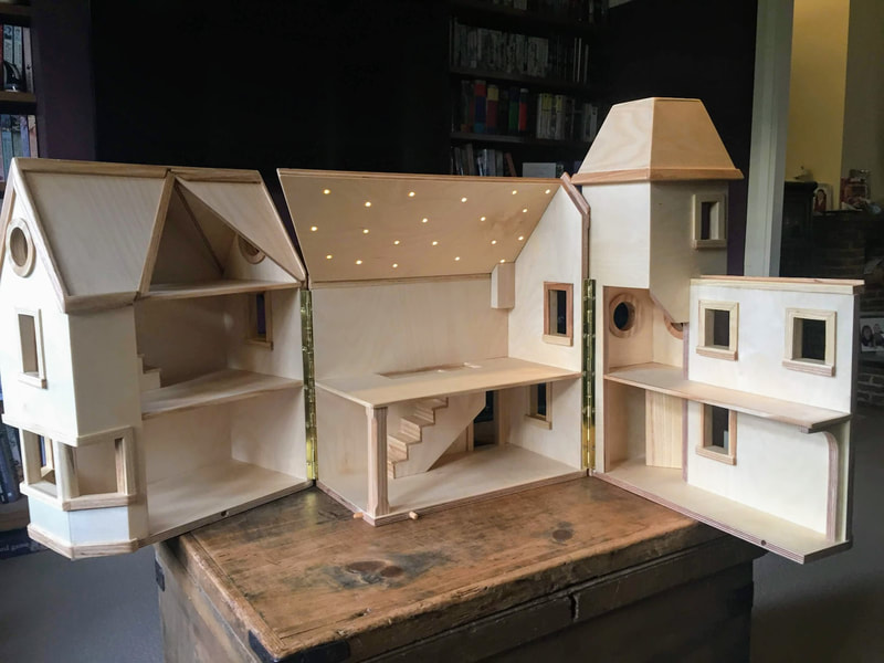 Doll's house interior, with starry ceiling.