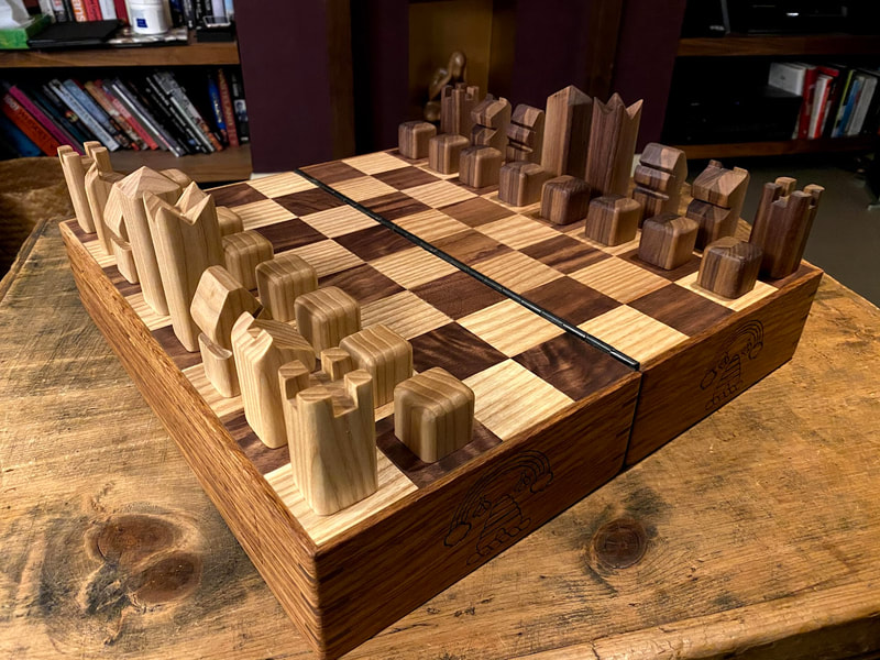 Travelling chess and draughts set with secret compartments for a future grand master.